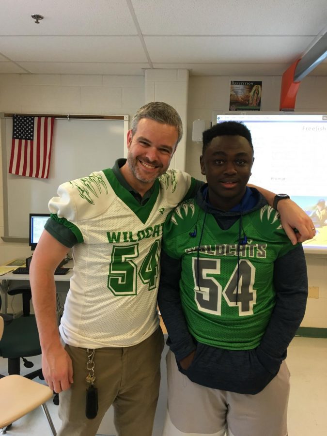 Junior Alex Coleman (right) stands with English teacher Ian Matthews.