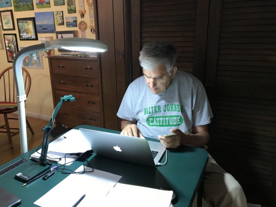 Physics teacher Bill Morris prepares to teach classes. One of the biggest challenges of online school for him is finding out whether a student completely understands course concepts. 