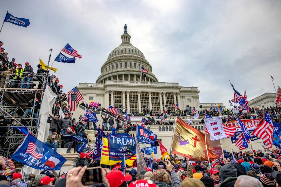 WASHINGTON,DC-JAN6: Supporters of President Trump storm the United States Capitol building.  (Photo by Evelyn Hockstein/For The Washington Post via Getty Images)