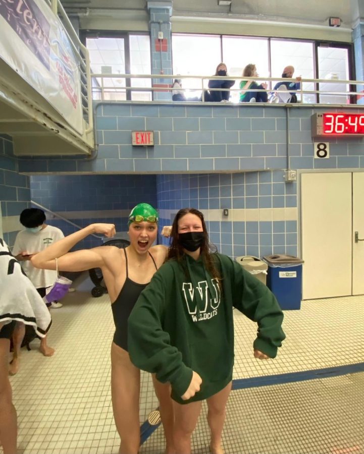 Karp (right) posing with freshman Isla Bartholomew during one of their recent meets. The girls team has been doing incredibly this season and they owe it a lot to the encouragement of Karp as a captain and her performance as a top swimmer.