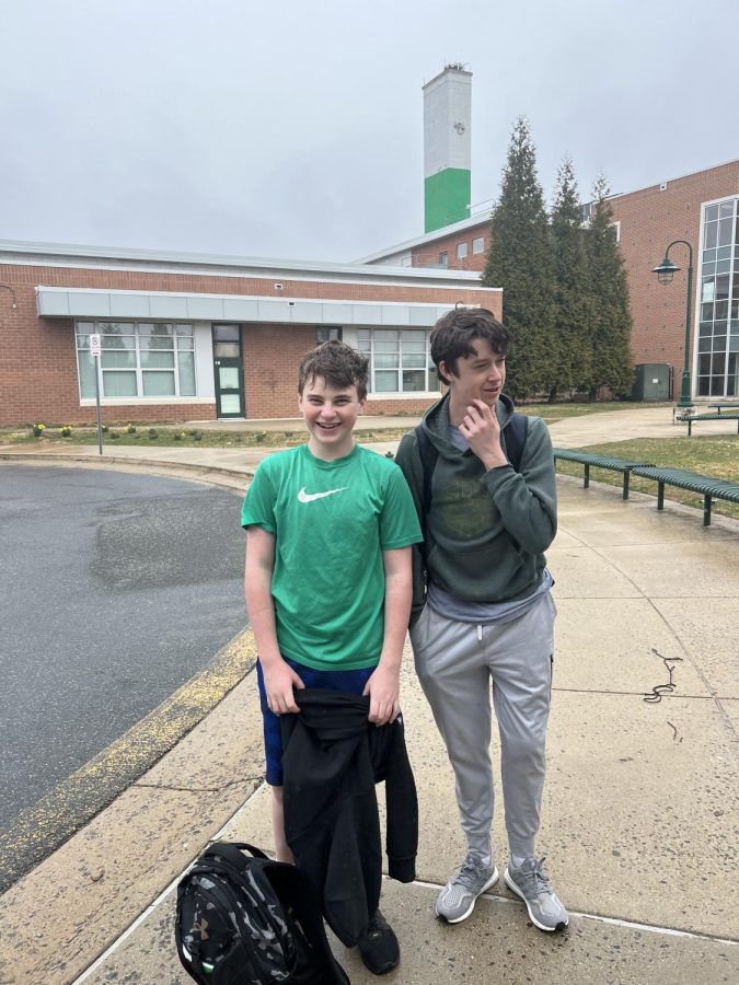 Freshmen Jake Greenfeld (left) and Noah Prevost (right) reveal their green tops on St. Patrick's day after lacrosse practice. "I liked wearing green today and pinching people who didn't wear it. It was a really fun spirit," Greenfeld said.