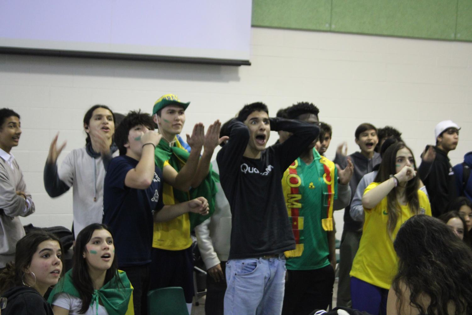 Students+watch+Brazil+vs.+Cameroon+with+Latin+club