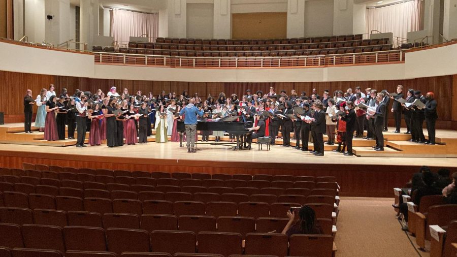 The Walter Johnson, Tacoma Academy and Centennial High Madrigals choirs in formal attire combine their efforts and voices on the auditorium stage in the University of Maryland. This was the first major performance for this year's Madrigals, with the upcoming winter concert being their next.