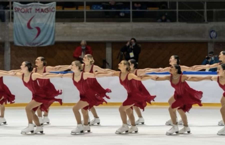 Clara Neal, front row, second to the left competes alongside her teammates at a seasonal competition. Neal competed on DC Edge, the US national synchronized skating team.