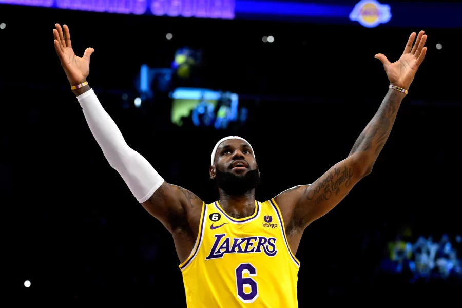 Lebron James lifts his hands to the sky as he celebrates becoming the all-time NBA top scorer, breaking Kareem Abdul-Jabbar's 39 year record.