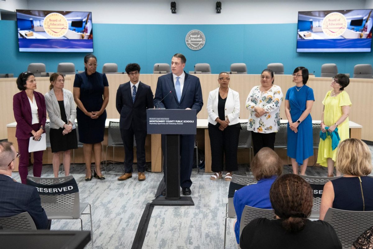 Dr. Thomas Taylor, the Board of Educations pick for the next superintendent, stands with members of the Board at the announcement on Monday. Taylor is a graduate of MCPS but has never worked for the district. (Courtesy MCPS News)