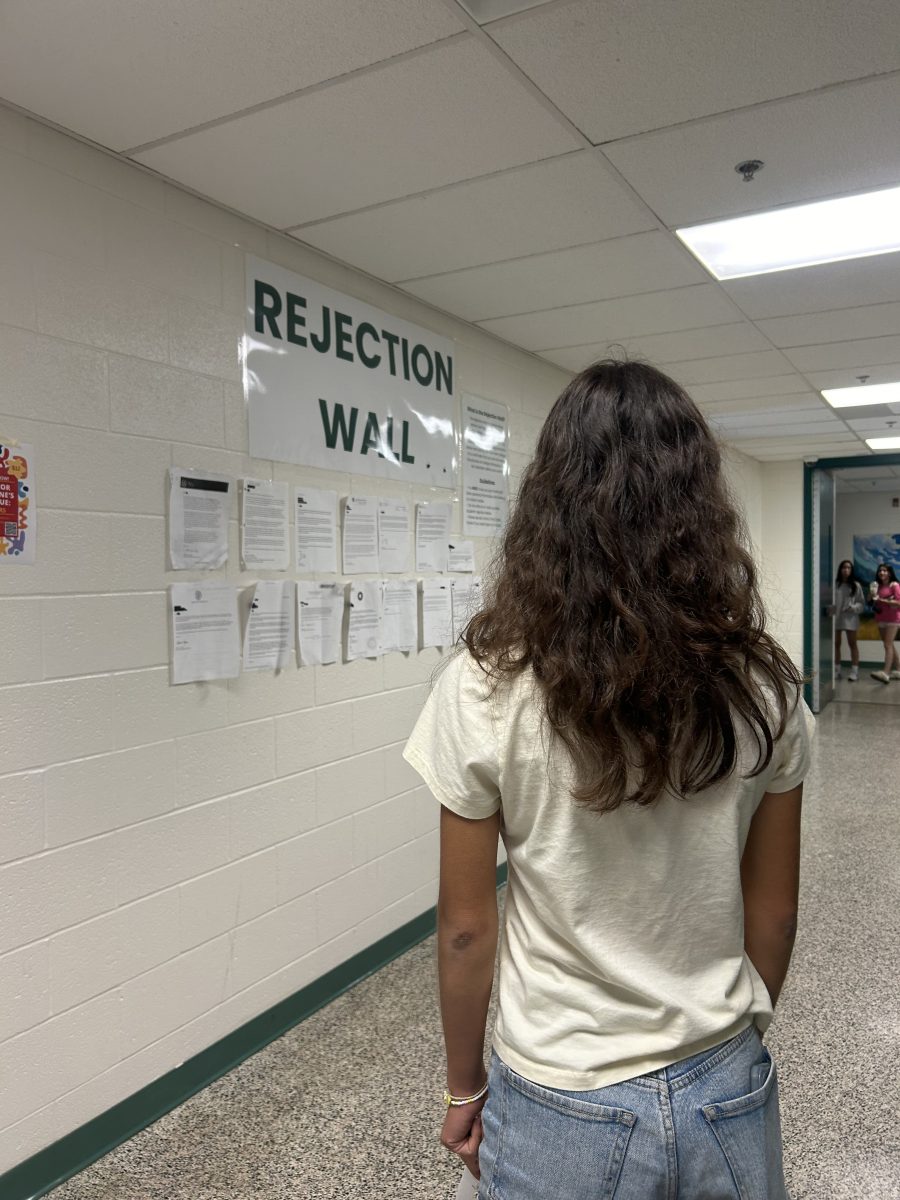 A student reviews the rejection wall. The rejection wall was created to encourage students to know that even if theyre rejected, theyre not alone. Im scared Ill be rejected from the schools I will apply to, so its comforting to know I wouldnt be the only one, junior Cristina Simpson said.