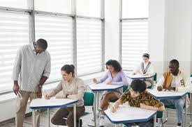 Students sit in rows for very extensive hours as they take exams. This is a common scene all across the US, however in MCPS this sight cannot be found. (Courtesy Pexels)