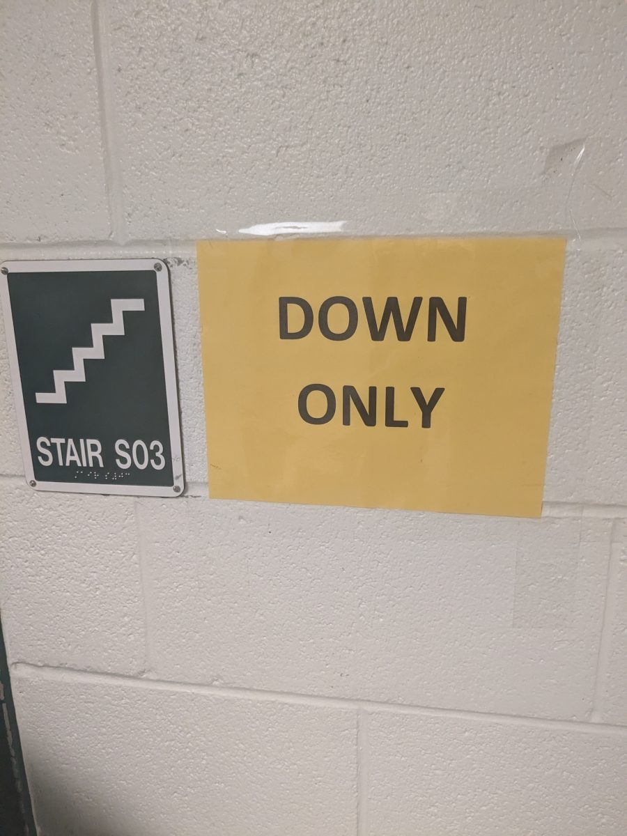 A sign at Walter Johnson indicates that students can only move down stairwell S03. However, students often ignore such direction moving as they please.