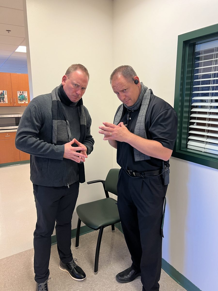 Assistant Principals Jeff Leaman and Terry Heintze, dressed up as Gru for Despicable Me day, mimic the movie villain's iconic pose.