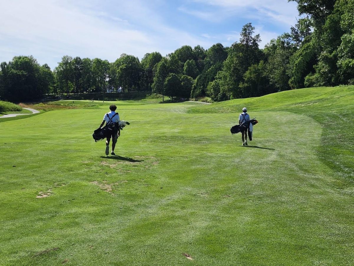 Co-captains Connor Kim and Paul Gomes walk across the golf course during a practice. Both players gave impressive performances in their match on Sept. 3. (Courtesy Paul Gomes)