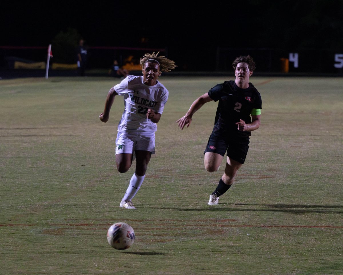 Junior Alessandro Marenco chases after a loose ball. Despite a game-tying goal, the Cats ended up losing to QO in overtime. (Courtesy Roy Rozin)