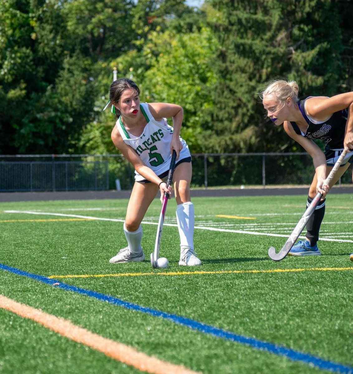 Senior Francisca Siboni clears the ball up the sidelines for a defensive stop. The Cats ended the game 5-3 against Holy Cross in a controlling win.