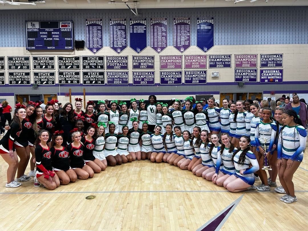 The WJ Cheer squad poses with the Quince Orchard cheer squad and the Churchill cheer squad after the Invitational on Oct. 9. The WJ squad scored the highest in WJ history in the pyramid category in difficulty and execution. (Courtesy Holly Siegel)