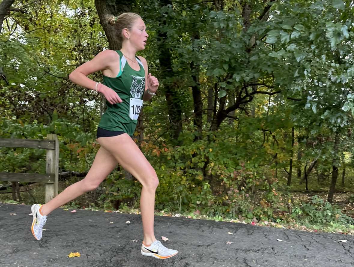 Megan Raue heads toward the finish with a strong push ahead of her opponents. She sprints to the end, eventually obtaining a new personal record.