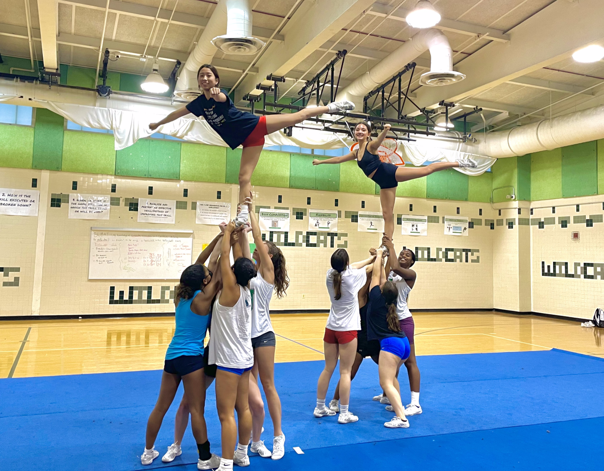 Varsity cheer drills their routine on Tuesday, Sept. 24 to prepare for their Invitational at Long Reach High School on Oct. 9. The team has been working on sharpening their technique since the start of the season. “I would say everyone is striving to be better and to get what they have to get," Head Coach Vanessa Barnes said. "A lot of them are pushing themselves to get where they need to go."