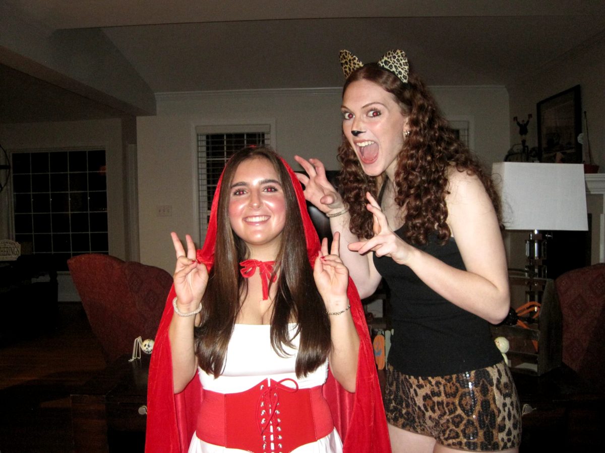 Senior Hildi Altman and Stella Lichter dress up for Halloween in a Little Red Riding Hood costume and a cheetah costume. (Courtesy Stella Lichter)