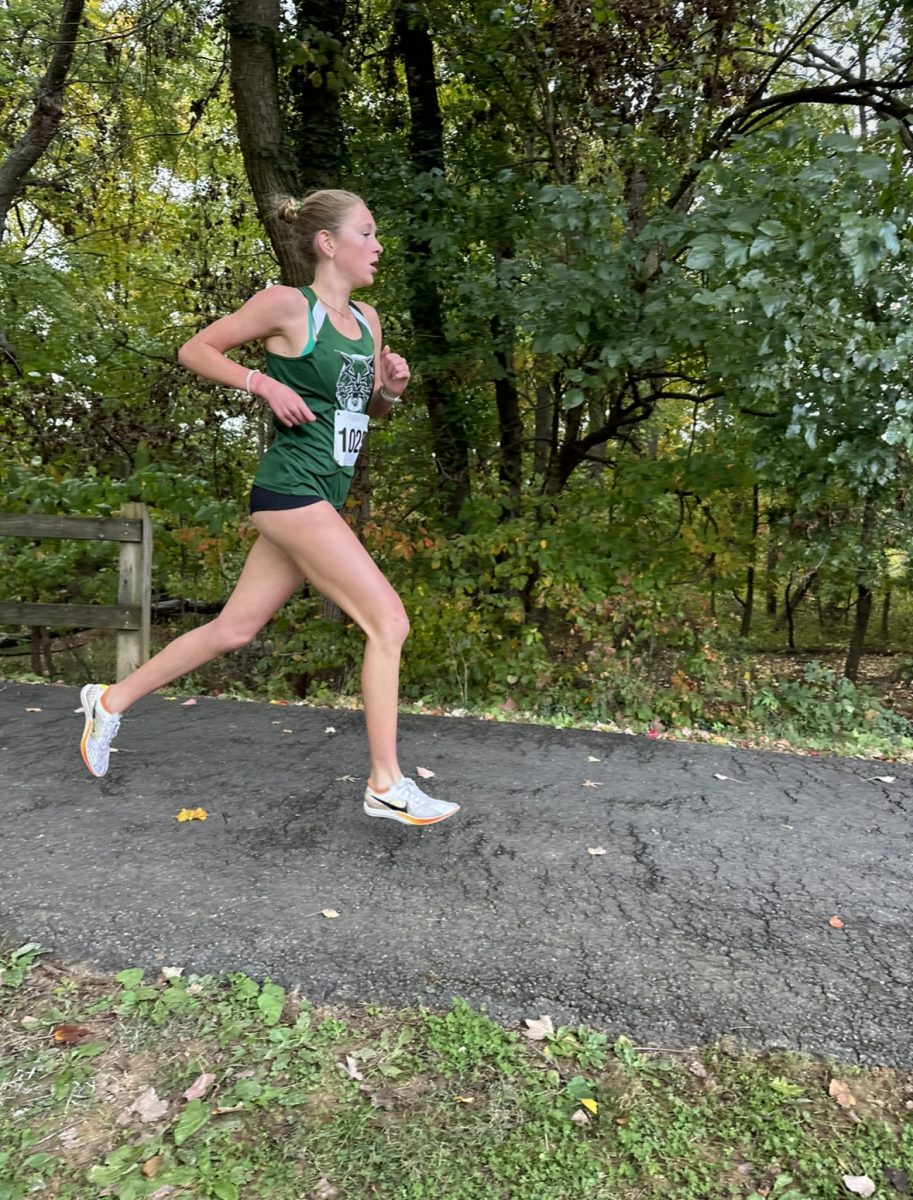 Megan Raue heads toward the finish with a strong push ahead of her opponents. She sprints to the end, eventually obtaining a new personal record.