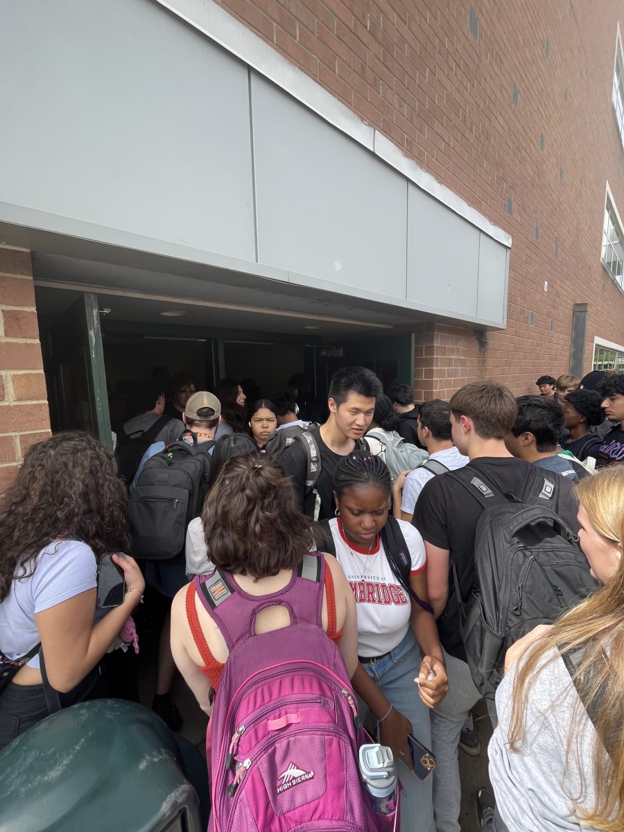 Students push through a swarm of their peers going to and from the portables during the transition from sixth to seventh period. Getting into and out of the building can take up to several minutes.