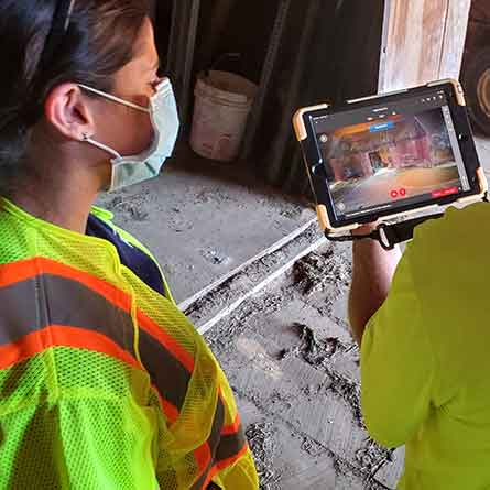 Samantha Arenberg works at a site inspection of a historic barn. They used drones to create an accurate 3D imaging of the barn to help identify areas of structural concern. “I miss certain aspects of my job. I miss being able to eat when I want, and go to the bathroom when I want, and the time flexibility. But I don’t miss being in a cubicle for nine hours a day, and feeling like I wasn’t helping people,” Arenberg siaid.