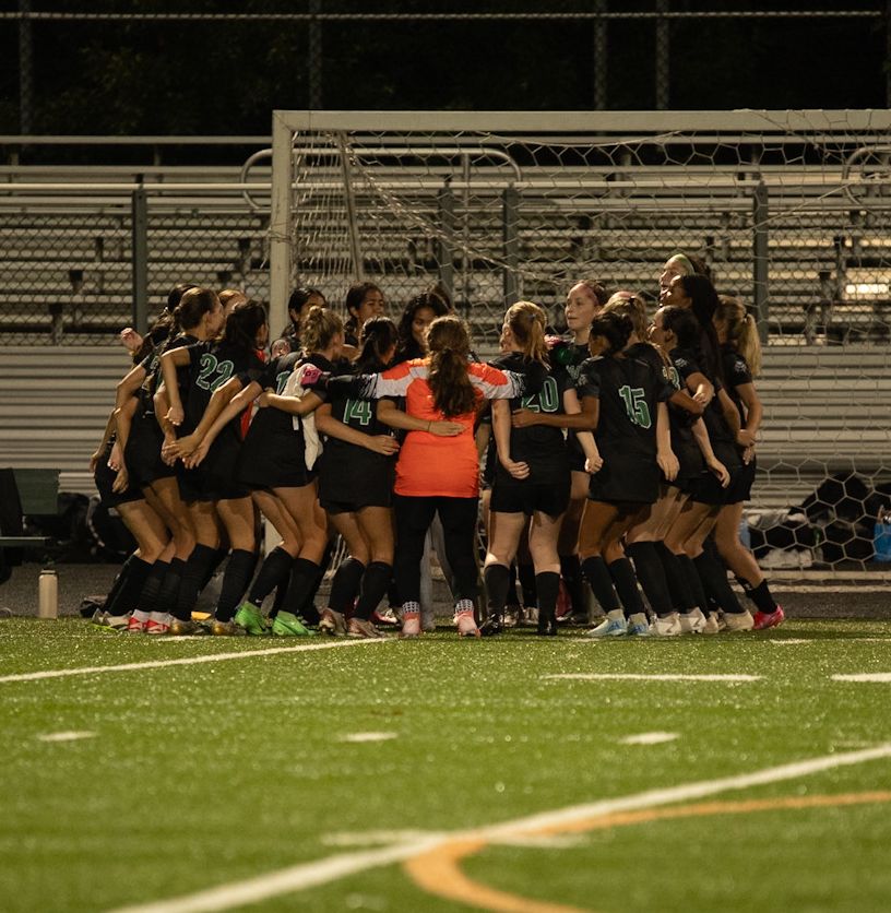 The Wildcats huddle up shortly before the start a game. The team has a big playoff game tonight against B-CC, with hopes of advancing to the second round. (Courtesy Lifetouch)