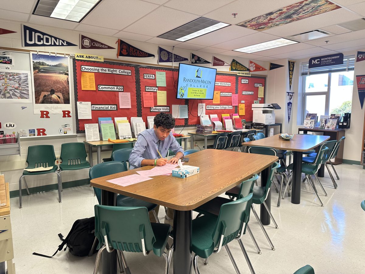 Senior Farhad Sharifai works on transcript request forms in the College and Career Center (across from the Counseling offices). Students are required to fill out one transcript request per school. The first five are free and any more is &#36;5 each.