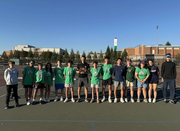 The WJ pickleball team poses after receiving the county title trophy. The team tied with Damascus for first place after winning their Division II matches.