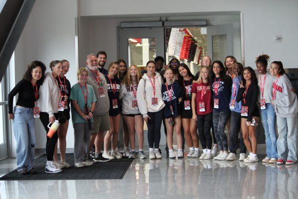 The team poses for a photo before beginning their tour with Johnson. The Cats were given a full tour of the University of Maryland football facilities. "My favorite part of the tour was getting to meet players from the actual team. They were all so nice and we got to take pictures with them," senior Mimi Dietrich said.