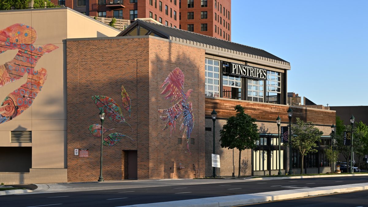 The Pinstripes building in Pike and Rose featuring its outdoor terrace. Pinstripes is in the middle of a popular outdoor shopping center close to WJ. (Courtesy Wikimedia Commons)