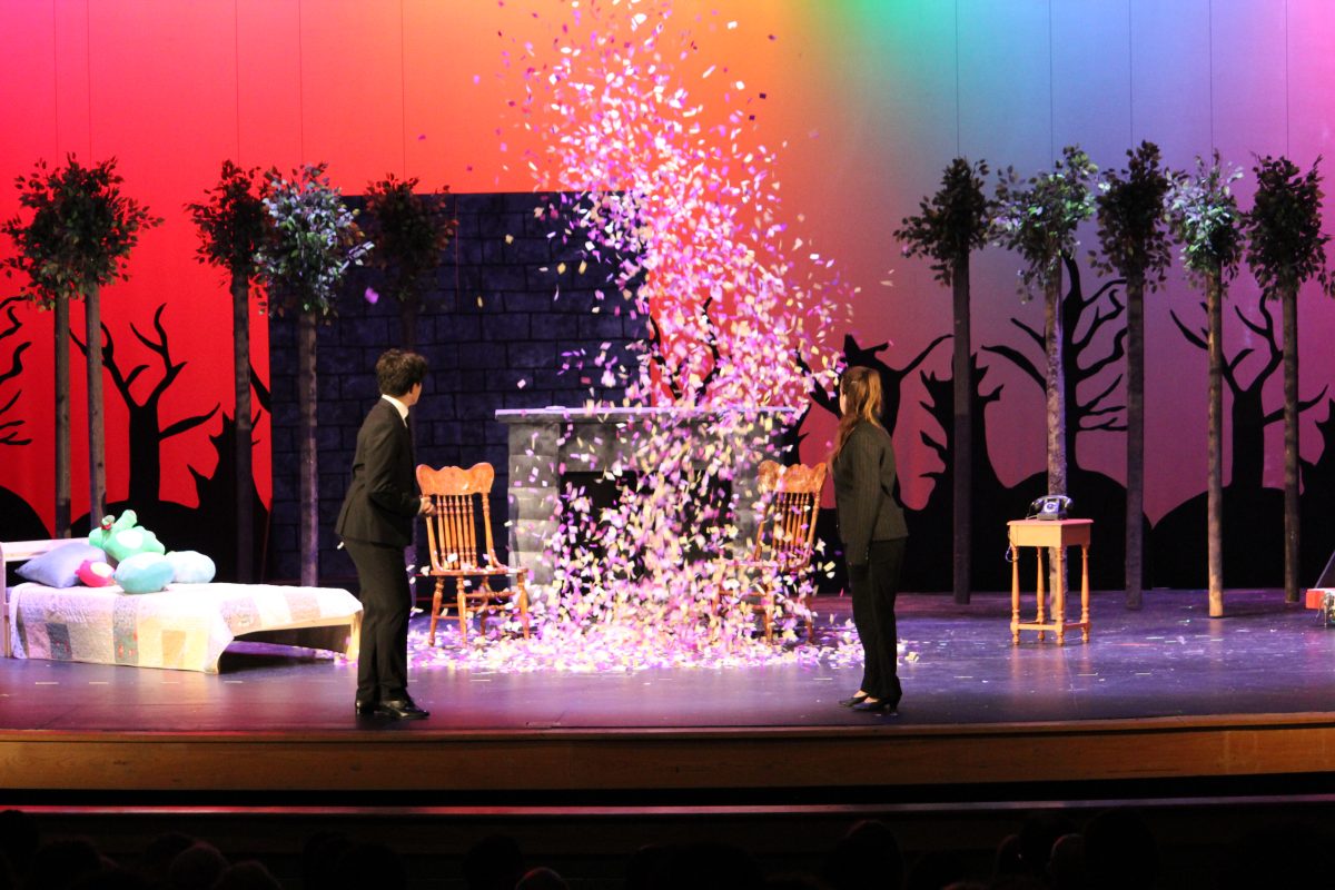 Opening night's narrators, juniors Yuri Sternberg and Sasha Rotton, turn to watch a wave of confetti is dropped onto the stage. The performance was unusually colorful, complementing its chaotic nature. "I’m really proud of the cast and the way we were able to come together and work towards putting on the show,” Rotton said.