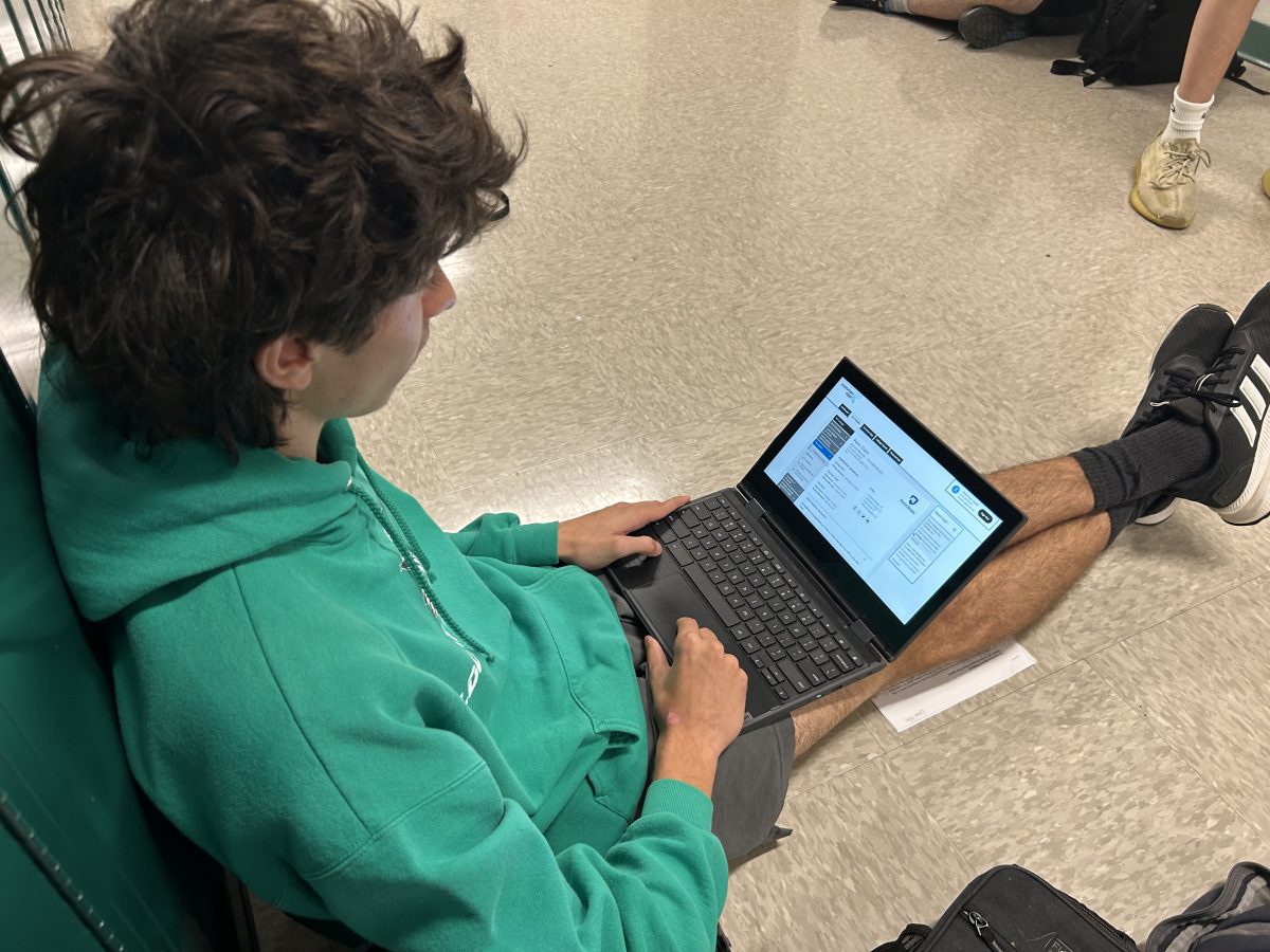 Senior Lloyd Erim works on his application for Pennsylvania State University. Many seniors have had to get recommendations from one or two teachers to meet the requirements of their college applications.