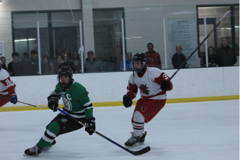 Captain Patrick Murphy skates past a defender on a race to the puck. Murphy's defense was a huge contributor in the 1-9 win against Blair.