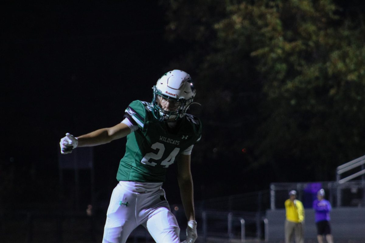 Junior WR Corey Dooren checks with the referee that he is on the line of scrimmage. Dooren helped step up throughout the Wildcat's season and will continue to step up as he matures into a senior next year. 