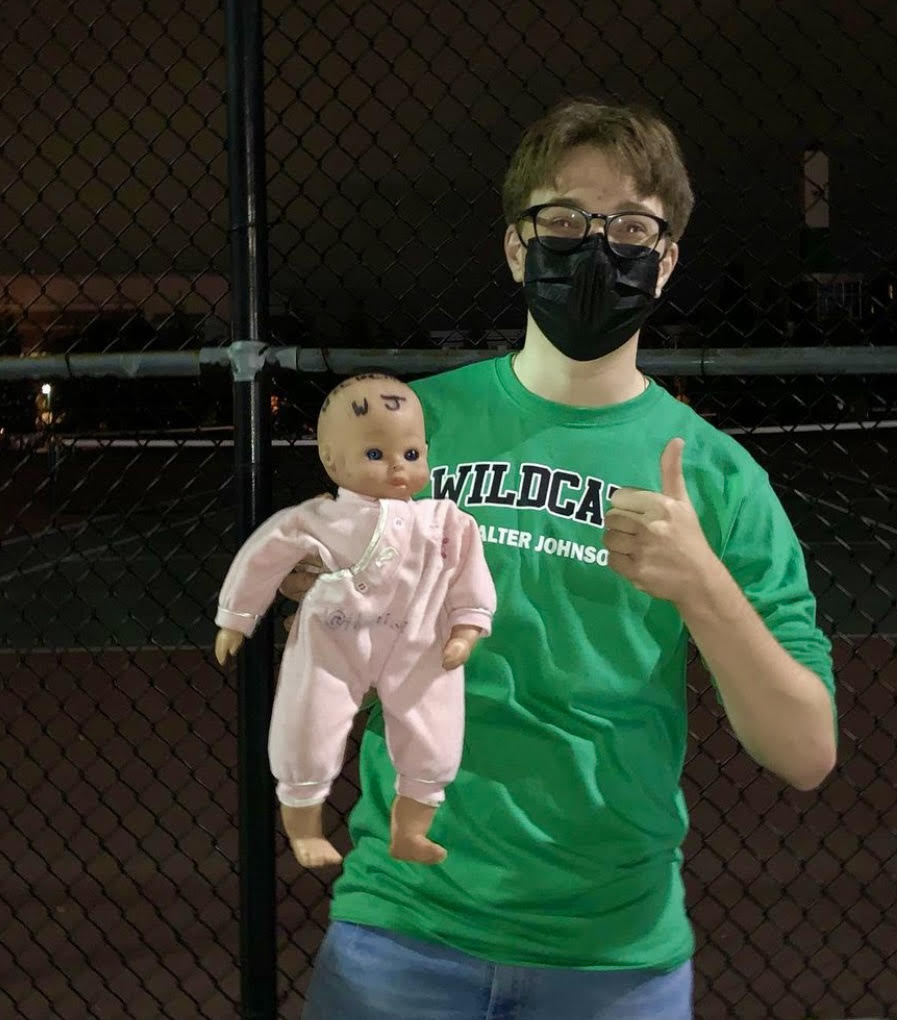 The WJ Baby is held up for a photo by one of its fans during a football game in 2021. Unfortunately, the baby was only able to attend one football game this season before being incarcerated. (Courtesy WJ Baby)