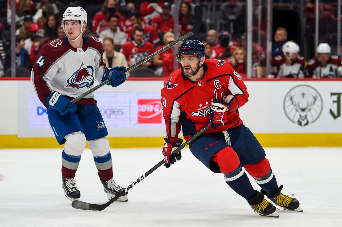 Washington Capitals captain and forward Alex Ovechkin tracks the puck while Colorado Avalanche defenseman Bowen Byram skates behind him getting ready to defend. Both teams are competing for playoff spots this season. (Courtesy Brian Murphy via Wikimedia Commons)