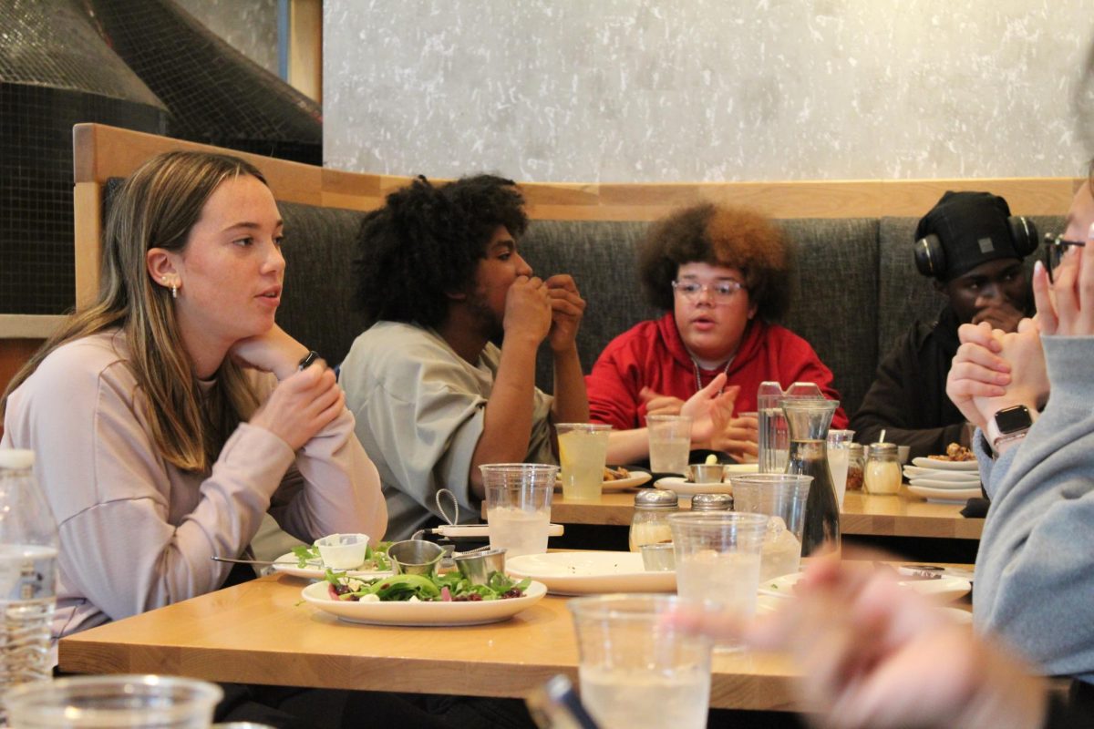 ASL 2 students eat at Mozzeria, a deaf- owned restraunt. Students practiced their signing with the deaf employees to order their food and drinks.