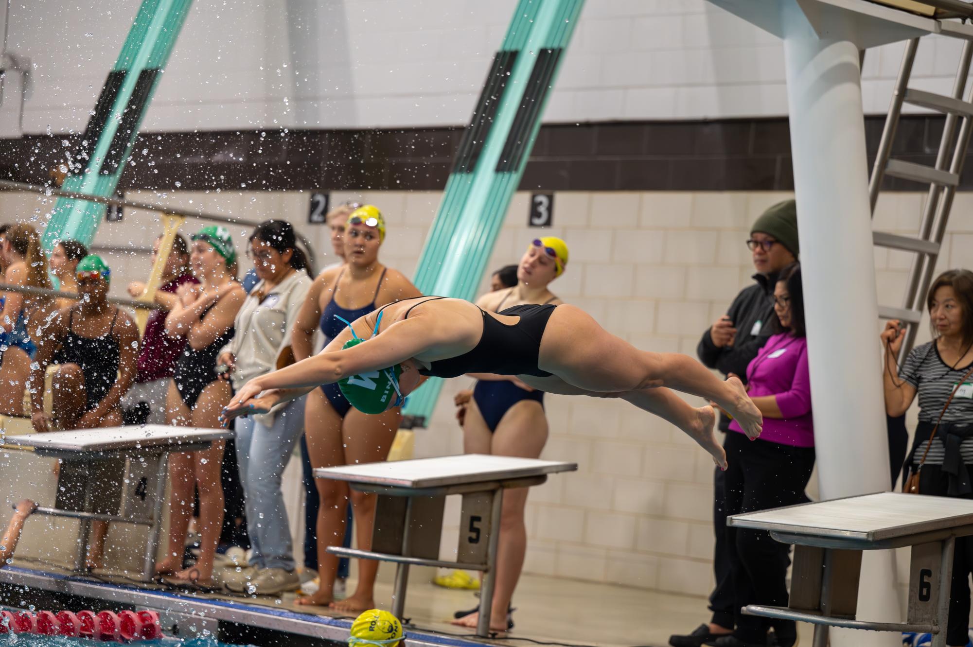 Senior Maia Bingley dives into the pool in a scrimmage against B-CC. The team ended up beating B-CC but will have to keep up the momentum as they face Whitman this Saturday. (Courtesy Owen Friedman)