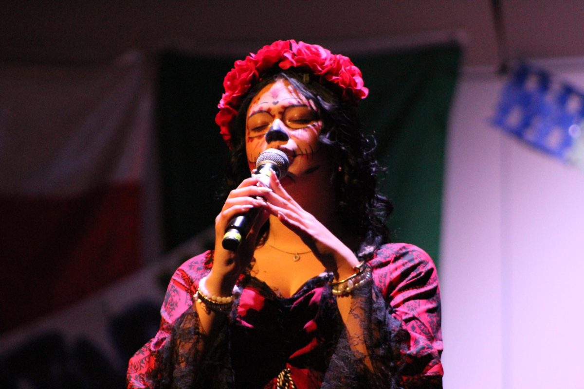 Senior Victoria Merida sings La llorona, a cultural favorite song. She wore traditional makeup and clothing associated with the Day of the Dead, or Día de los Muertos.