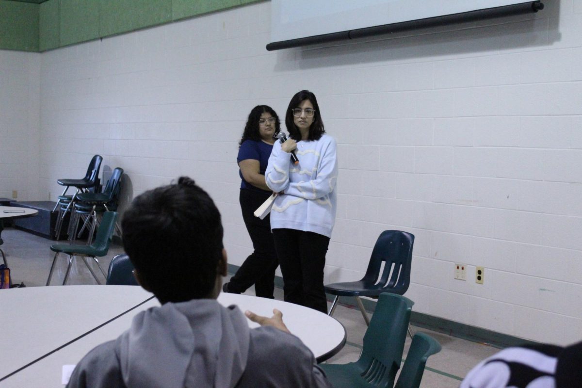 Freshman Lal Agarwal asks a question during the mock press conference. The press conference was an opportunity to practice interviewing as a journalist.