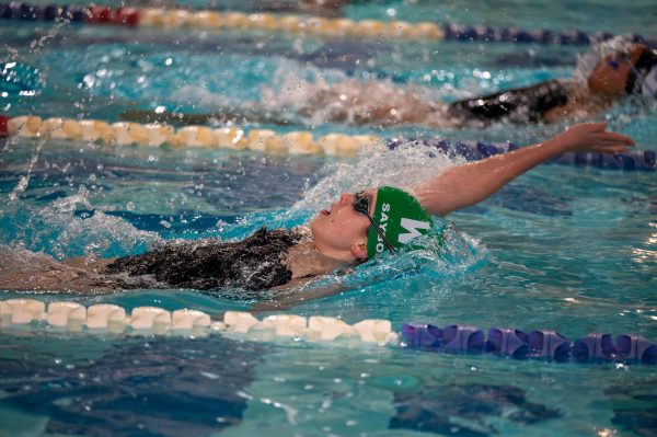 Sophomore Elanor Saybolt swims backstroke in a meet against Whitman. Saybolt and her teammates will have to step up as they lead the team into the postseason. (Courtesy Tom Murphy)