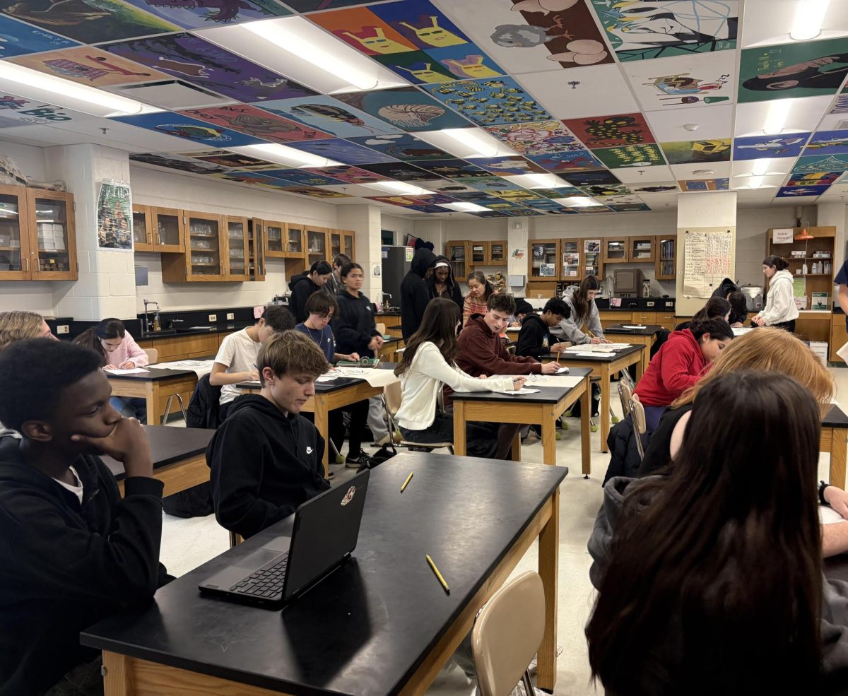 A class of freshmen works hard on a lab project in APEX Biology, a notoriously tough course for new students. Academic pressure tends to increase as the year goes on in advanced classes like this, causing difficulties for some students.