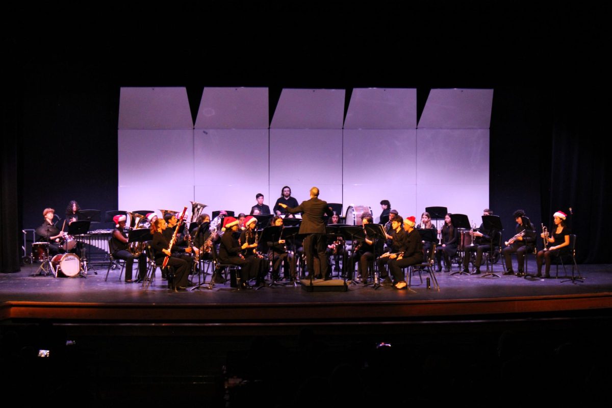 Dr. Michael Helgerman leads the Symphonic Band, one of the five ensembles that performed at the instrumental music department's winter concert on Thursday, Dec.12. The performance was highlighted with many Christmas classics such as "The Polar Express" and "Let It Snow."