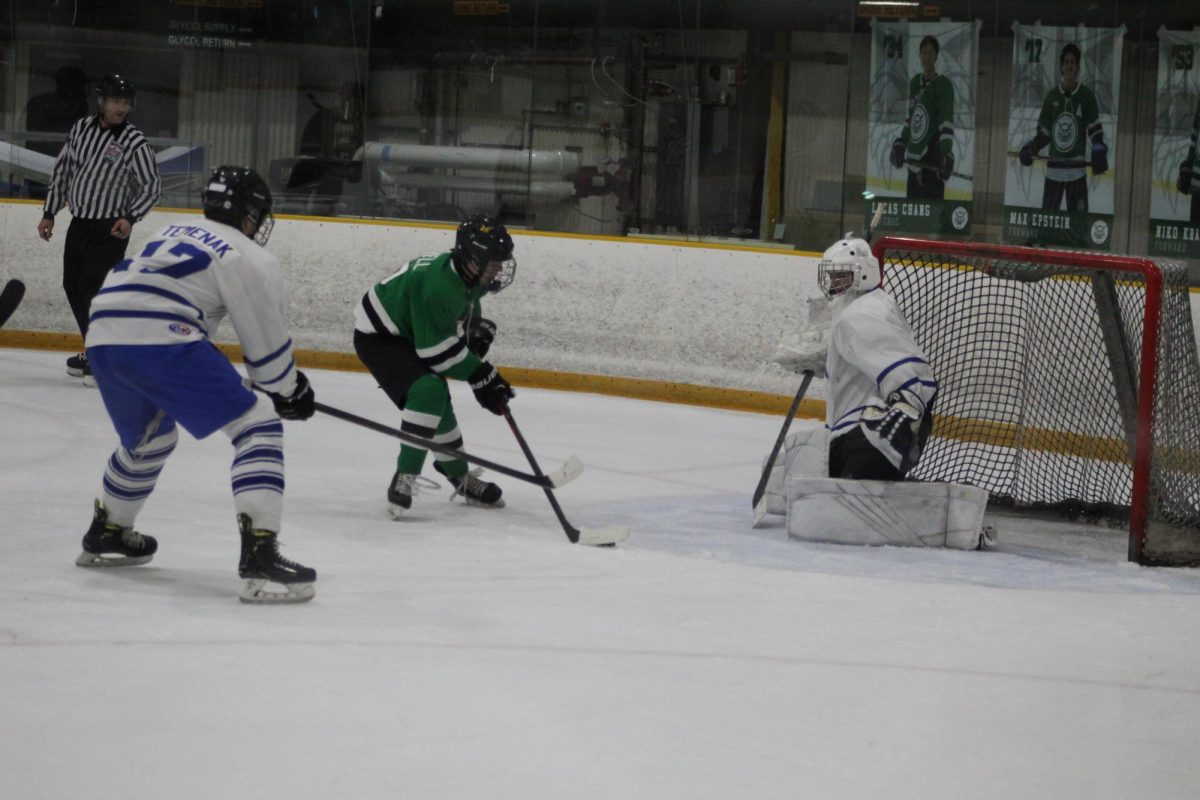 Junior alternate captain Henry Horwell takes on the goalie uncontested for an up-close wrist shot. Horwell helped lead off the Cats this game with a hat trick.