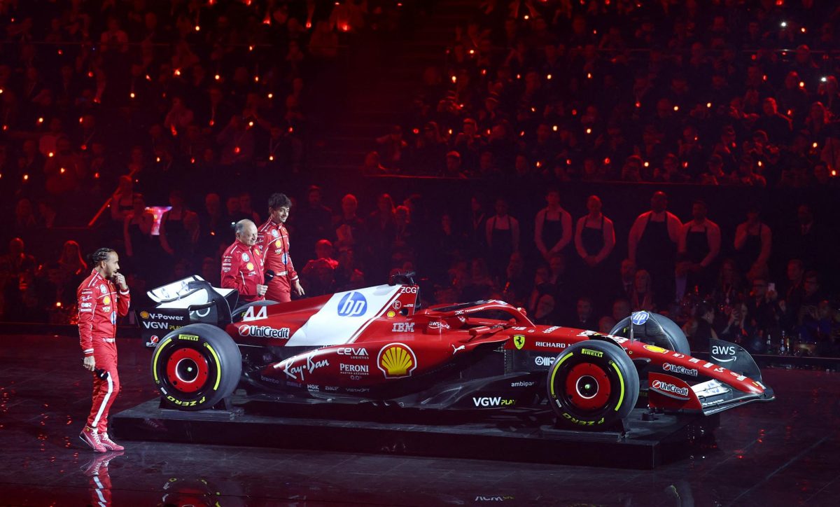 Formula One F1 - F1 75 Live Season Launch - The O2, London, Britain - February 18, 2025 Ferrari team principal Frederic Vasseur with drivers Lewis Hamilton and Charles Leclerc during their car reveal at the launch REUTERS/Andrew Boyers