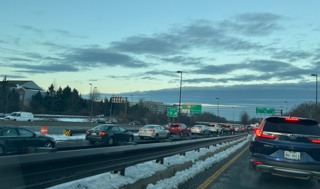 Cars back up onto the highway on the morning of Monday, Jan. 13. The traffic light ahead has very short left turn cycles, meaning it takes a long time for the backup to lessen.