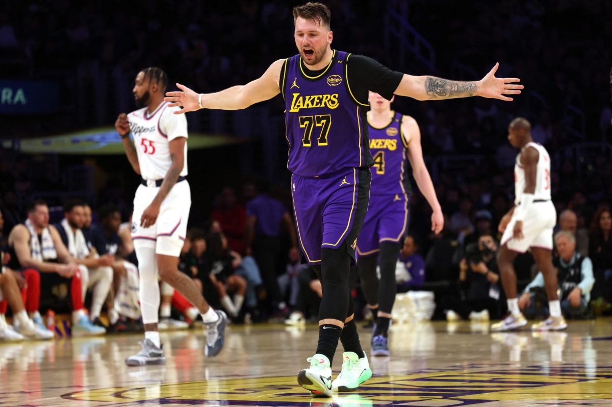 Feb 28, 2025; Los Angeles, California, USA; Los Angeles Lakers guard Luka Doncic (77) reacts after a play during the second quarter against the LA Clippers at Crypto.com Arena. Mandatory Credit: Jason Parkhurst-Imagn Images