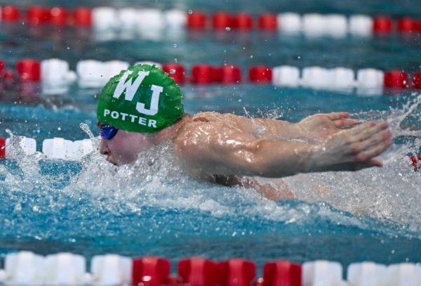 Senior Noah Butterfly swims butterfly in a WJ Swim Meet. Although fly is his best stroke, Potter also medaled as an anchor of the 200 freestyle relay at the state championship, with a final leg of 45.1. Potter's time was enough to help break a school record, which people have come to expect from Potter.(Courtesy Marcus Chen)