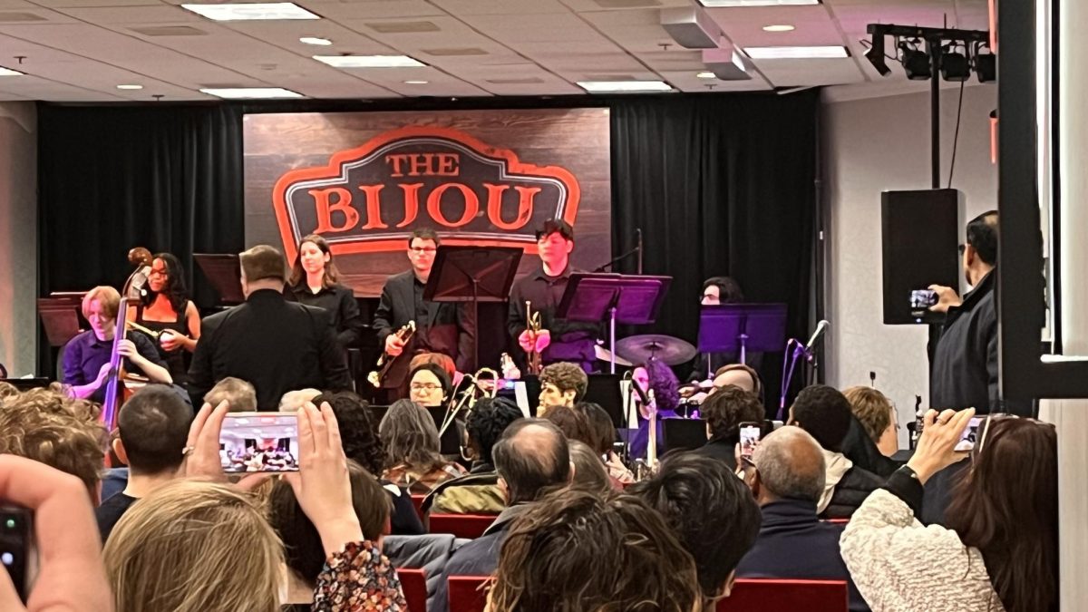 WJ Jazz Ensemble prepares for next song. The ensemble performed on The Bijou stage at the Mid-Atlantic Jazz Festival, Feb. 15. “When I first auditioned I wasn't really familiar with [the genre], but I feel like I’ve really grown a lot. As a jazz musician it’s pretty natural,” senior pianist Meley Ghermey said.