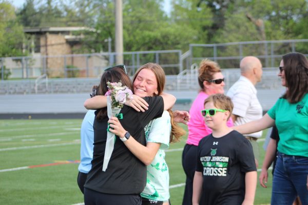 Senior captain Mallory Booth hugs coach Lauren Zucconi, thanking her for the season. "Lauren really listens to our input as seniors which is good to have in a coach," Booth said. "She wants us to have the best season for our senior year and really made senior night special."