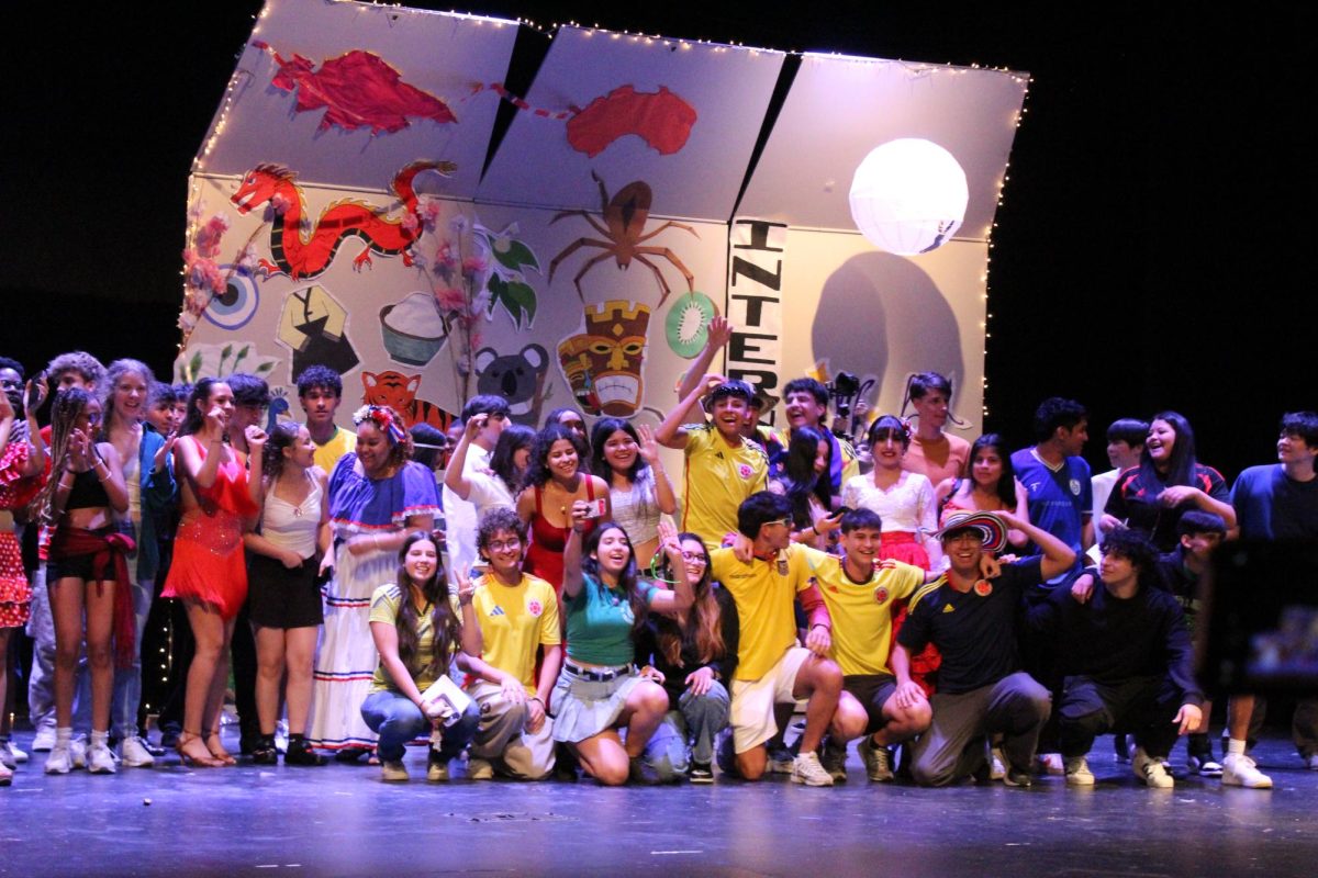 Performers gather together cheerfully following the end of International Night. "I think International Night is special because it is the only event that's almost entirely run by ESOL students," Won said.